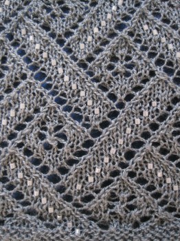 A close-up of the beautiful pattern. The lace will open up even further after blocking.